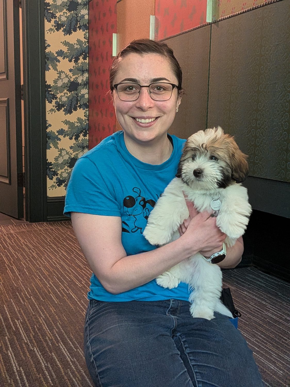 Carly holding a puppy